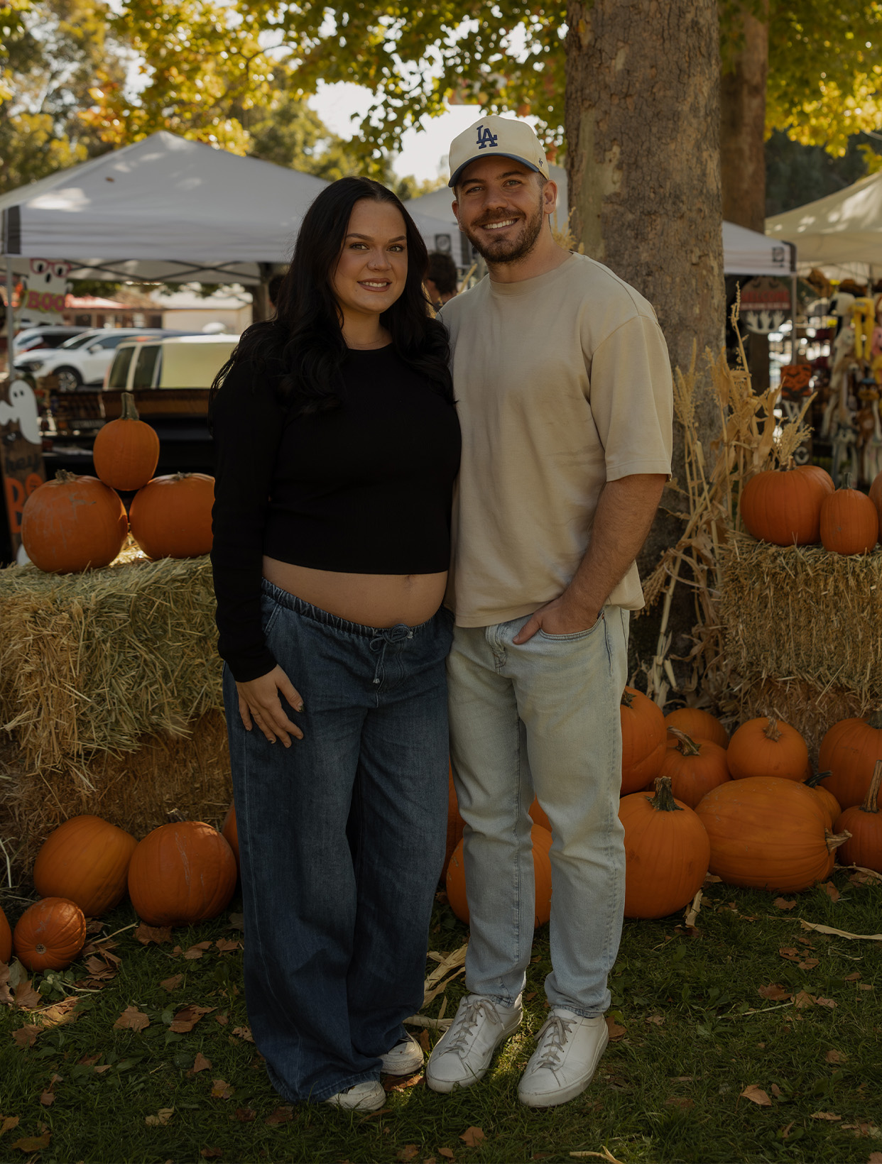 Zach and Maddy Wolfe at the pumpkin patch, expecting